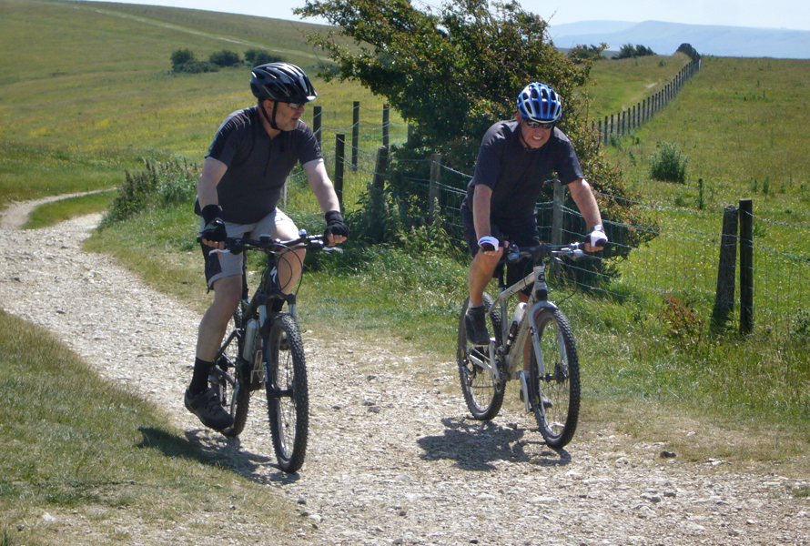 Friday June 26th (2015) Simon and Andrew approaching Ditchling Beacon. width=