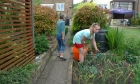28: Becky is helping Jude in the garden.