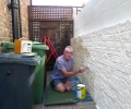 Painting the party wall again.